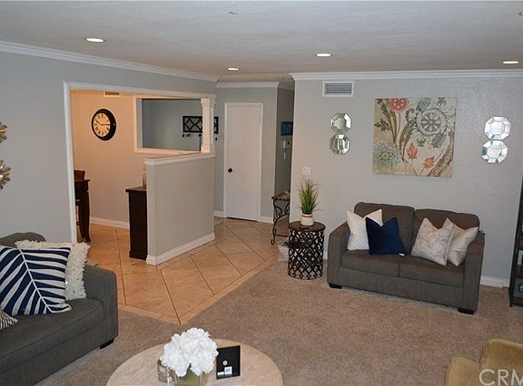 Beautiful Ceramic Tile, Recessed Lighting, Crown Molding & Decorator Paint Adorn The Interior of This Beautiful Home