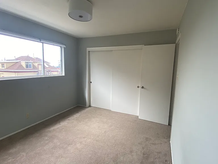 Spacious bedroom, bright window openings