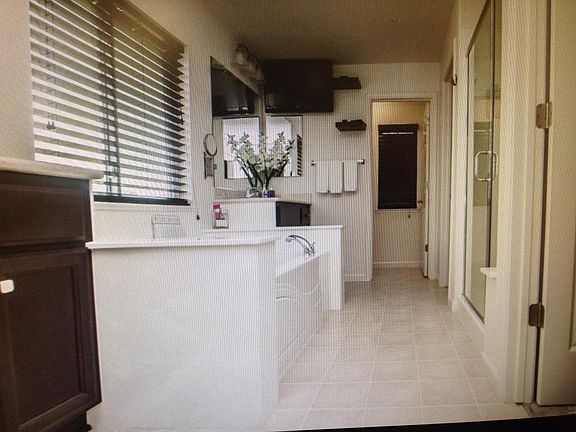 Master bath with his/hers closet and sink