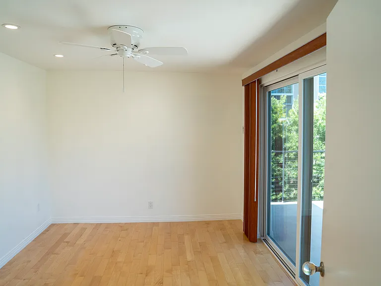 smaller bedroom/office with slider to patio