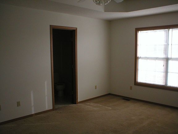 A view of the master bedroom, into the master bath.