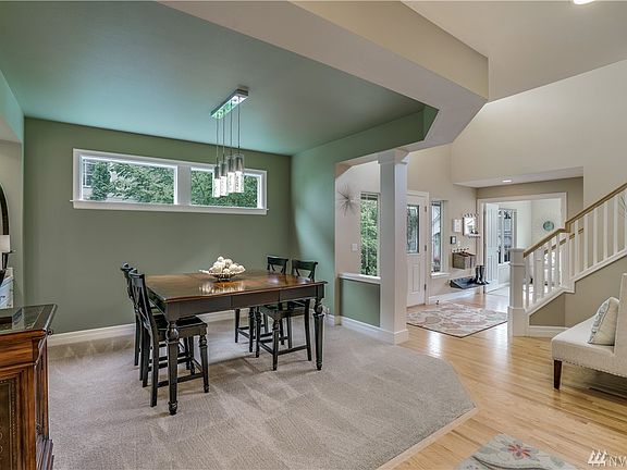 Formal dining room with built-in china cabinet and upgraded designer listing.