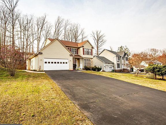 Long driveway leading to 2 car garage