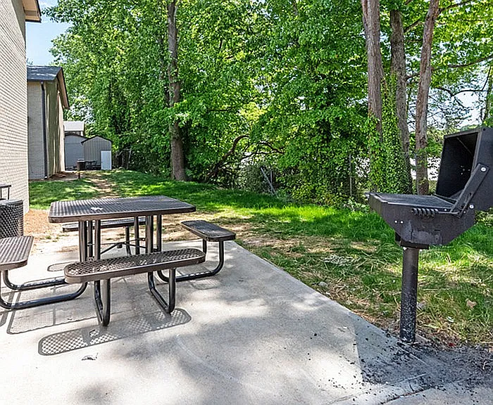 Enjoy alfresco dining in your private green oasis, complete with a grill for perfect summer BBQs.