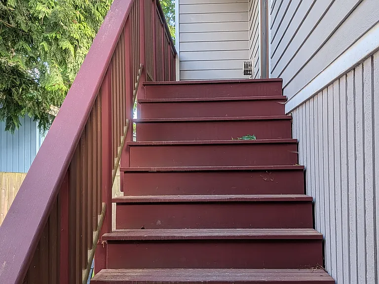 Stairs up to your private porch and apartment entrance