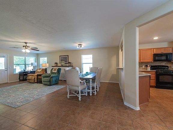 Upon entering you'll see an open floor plan with a spacious living room and island kitchen.