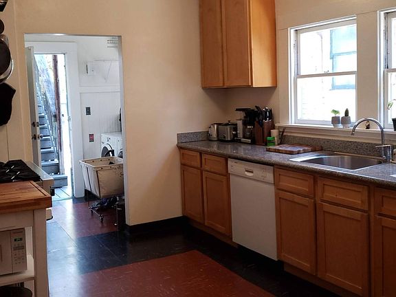 Large kitchen with dishwasher and Viking range