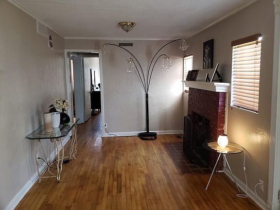 This is the living room area. The front door is to the right of the picture.