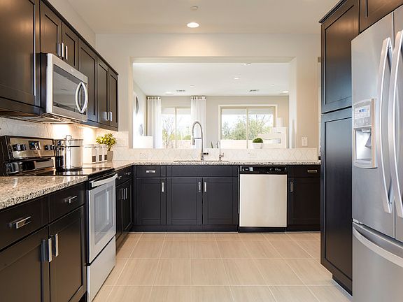 Abundant kitchen cabinet space and plenty of room for cooking