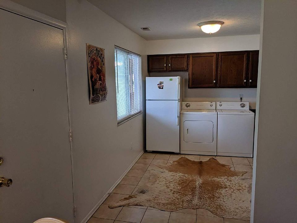 Front door and kitchen--full size washer and dryer