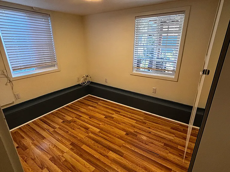 Cozy Bedroom, 2 windows, ambient energy efficient wall heater.
