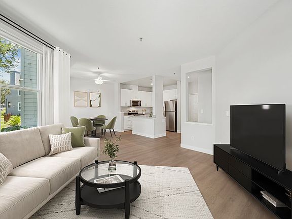 Renovated Package I living room with hard surface flooring