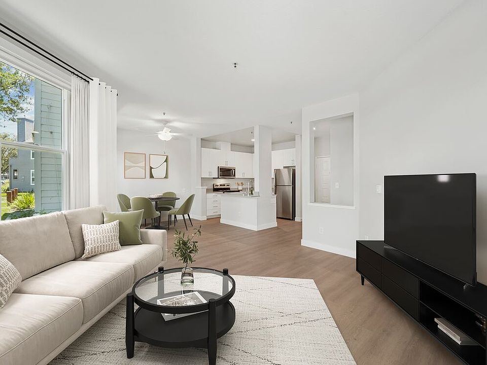 Renovated Package I living room with hard surface flooring