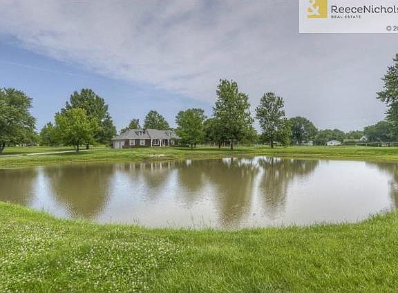 . . .a really nice ranch home with a pond in the front yard.