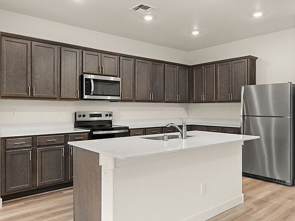 A spacious breakfast bar is the perfect spot for a quick meal.