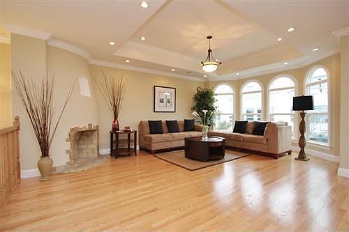 Gorgeous living room with original wood-burning fireplace