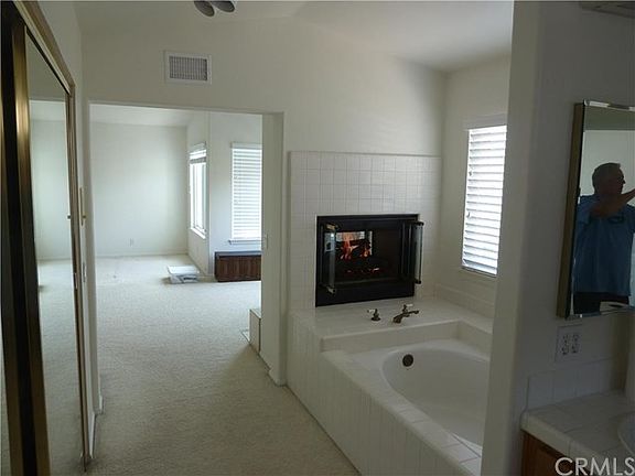 master bath with fireplace and large walk-in closet