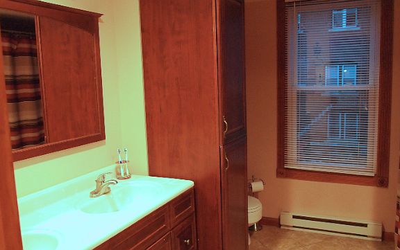 Large Bathroom with separate thermostat, and double sink.