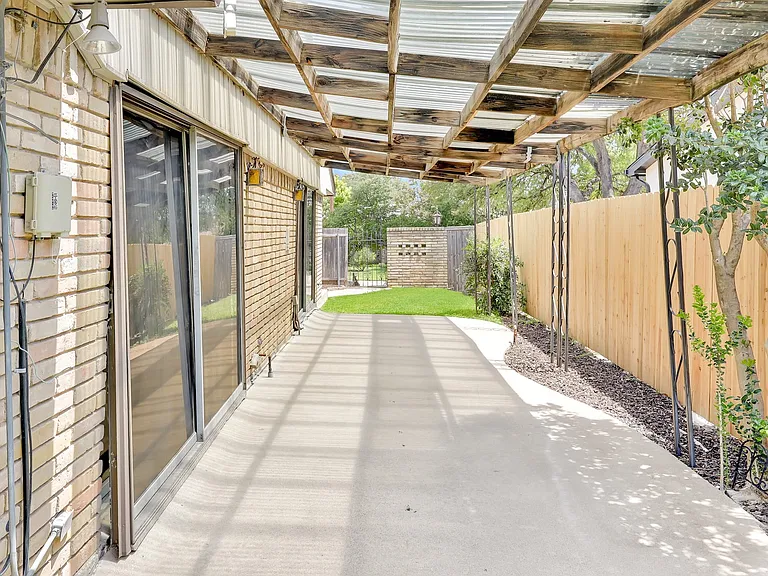 Large covered patio with room fit your table & chairs & BBQ grill.