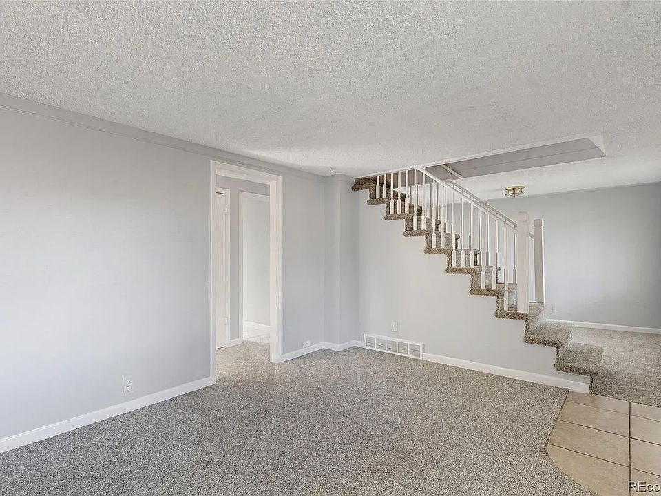 Living room and dining room with fresh paint and carpet