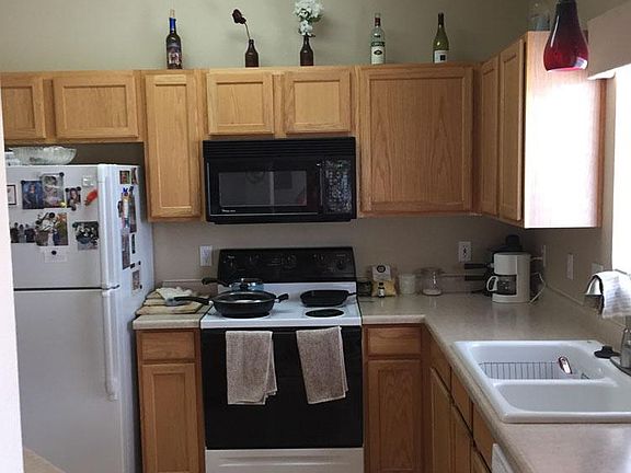 Kitchen with stove, frig, microwave, and dishwasher