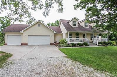 Exterior Front. Picturesque Cape Cod in a pristine 10 acre setting.