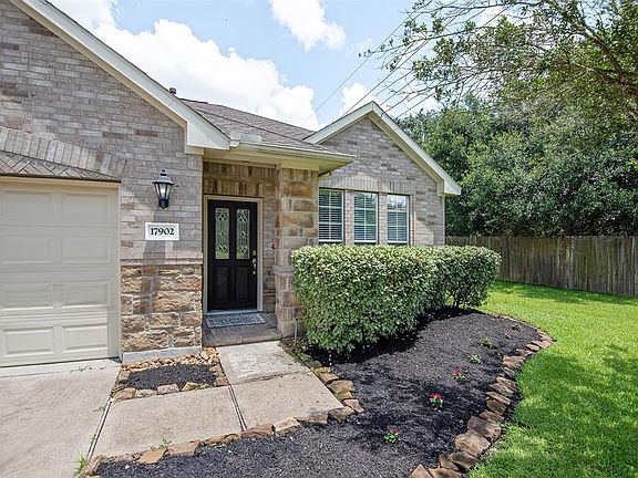 The stone and brick elevation adds an elegant touch to the exterior.