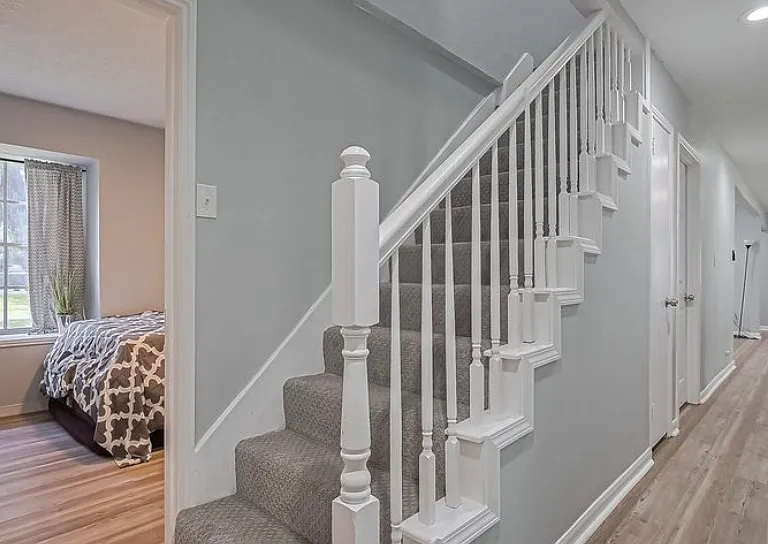 View of bedroom 3 and stair access to converted attic space