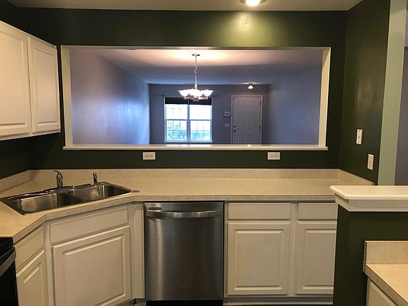 Kitchen with new stainless appliances.