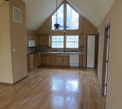 Open kitchen with cathedral ceiling