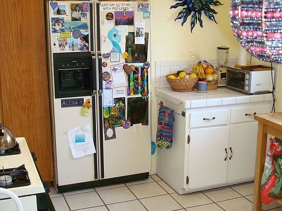 Kitchen has direct access to living room and family room.