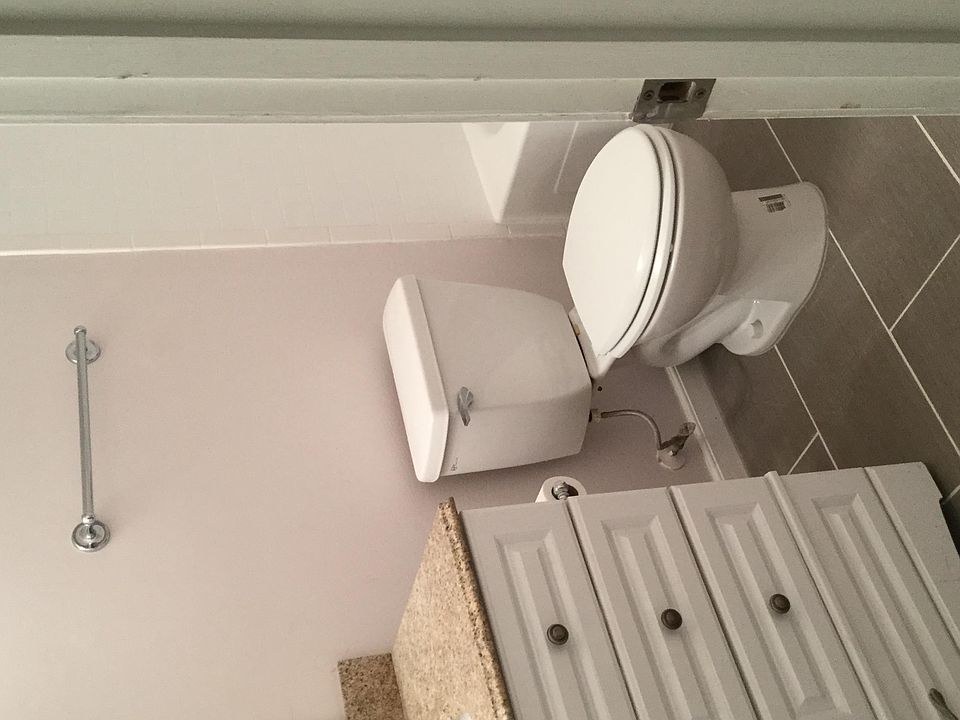 newly renovated bathroom, new flooring, new subway tile.