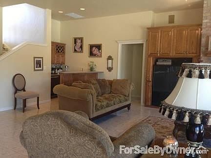 Huge Den
						:
						26 by 17 foot den with wet bar. Large picture windows overlook pool and lake.