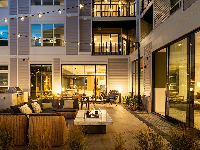 Courtyard with BBQ grills, fireplace, and lounge seating