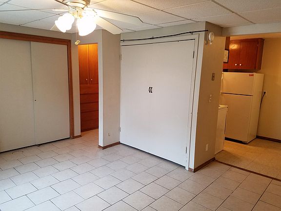 Double doors houses the full-sized murphy bed.