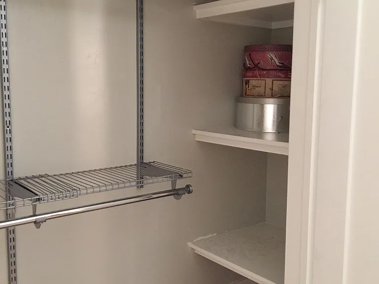 Bedroom 2 closet with built-in shelves
