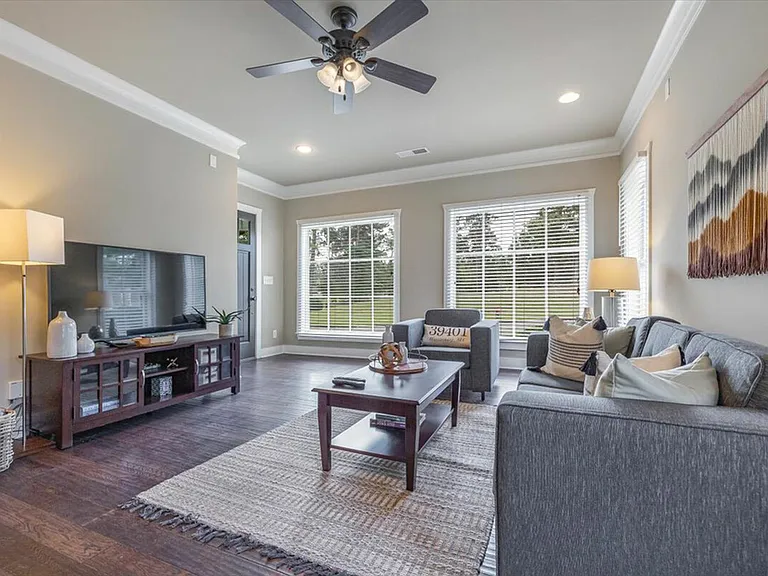 Spacious, modern living rooms at The Cottages of Hattiesburg for comfort and relaxation.
