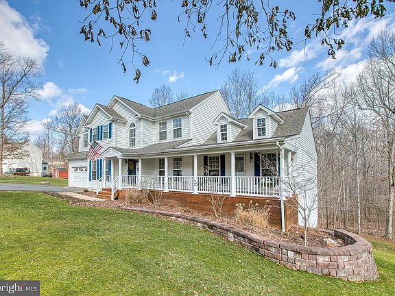 Nicely landscaped home with retaining wall