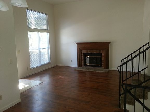 The great room provides a 2-story ceiling and gas log firepl