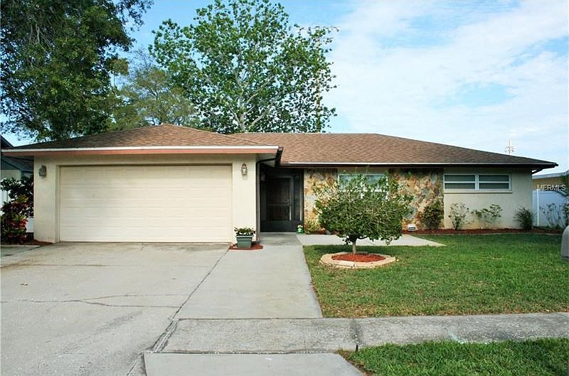 Exterior Front, extra wide driveway.