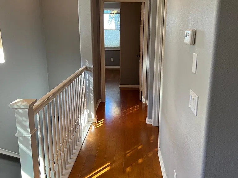 hallway to master (straight ahead) and bedroom 2 (right side)