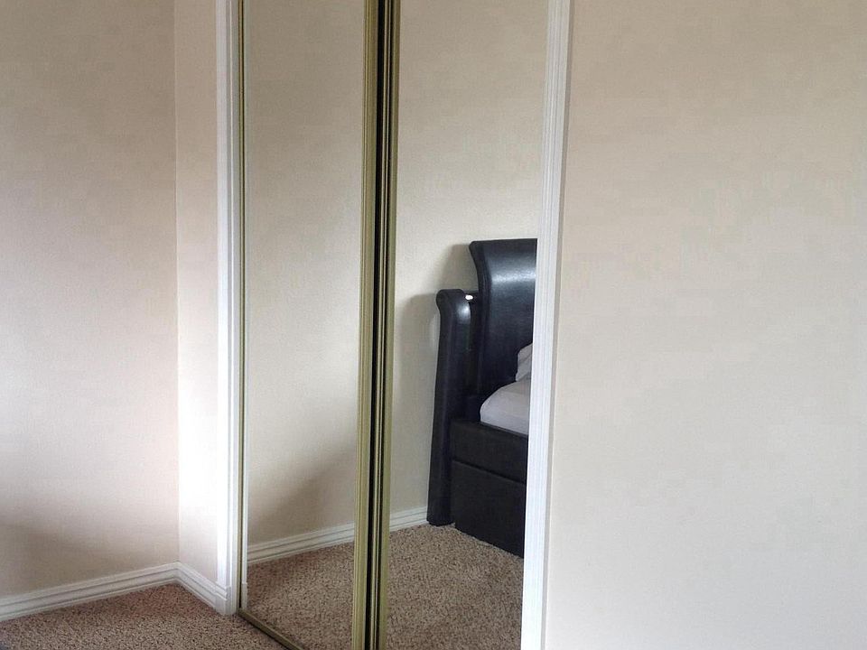 Mirrored closet in bedroom