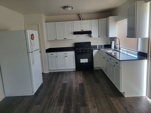 Full Kitchen with Pantry and Appliances, New lifetime warranty floor, new cabinets, new sink, new faucet and new granite countertops!
