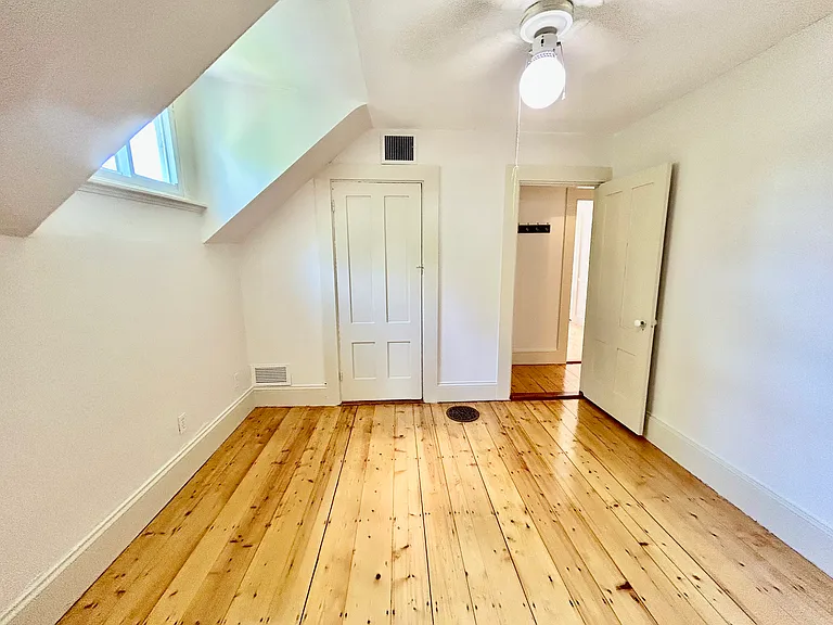 Bedroom or Living room with closet and hardwood floors - you decide _..