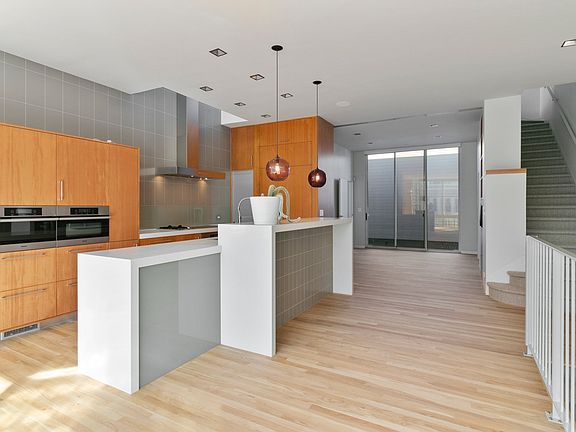 Light, airy kitchen with Miele steam oven, coffee maker, induction stove, speed oven and large oven and Subzero wine fridge. Newly finished floorboards