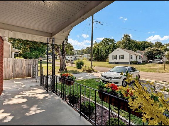 spacious front porch on a quiet street