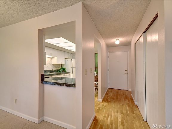 Hardwood floors throughout halls and kitchen 