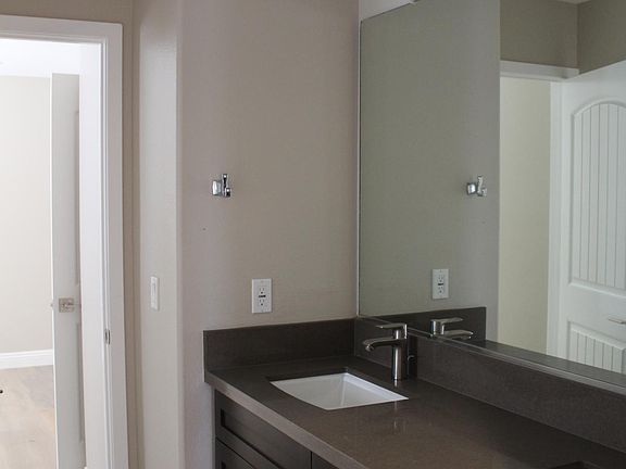 Brand new toilets, custom cabinetry with granite counter top