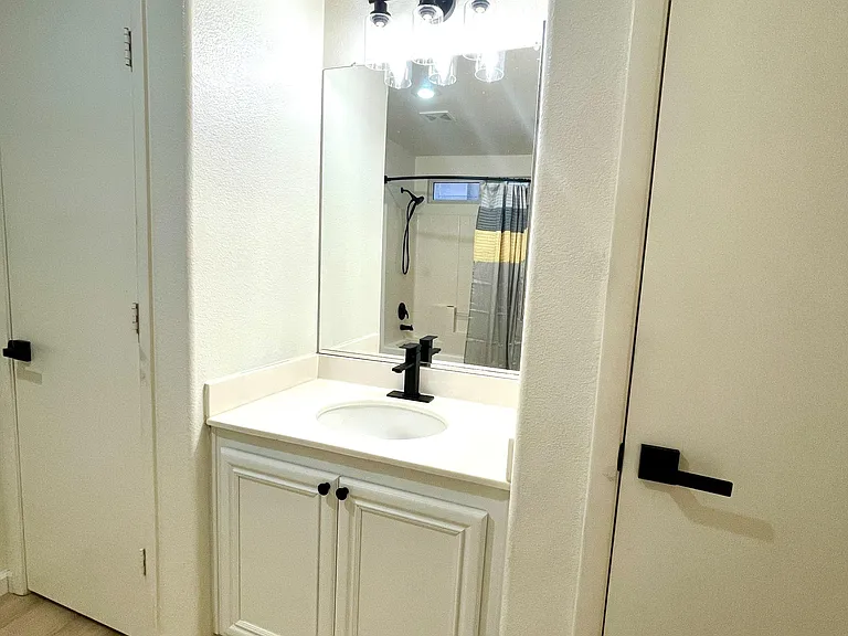 Sink vanity with closet storage on both sides