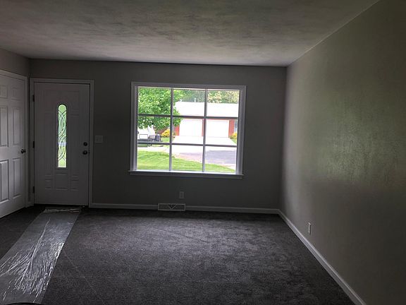 Large living room with coat closet